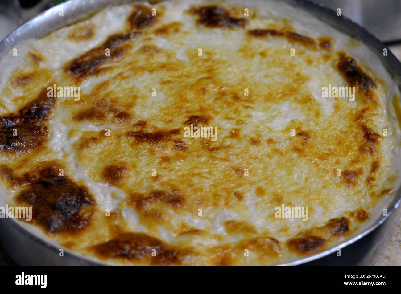Baked Egyptian rice or Roz muammar's combination of rice, fresh cream, milk, ghee or butter, a very popular Egyptian dish, a simple, sumptuous Egyptia Stock Photo