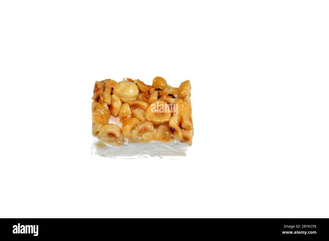 Hazelnuts on top of Arabic sweet delicious Noga, Egyptian cultural