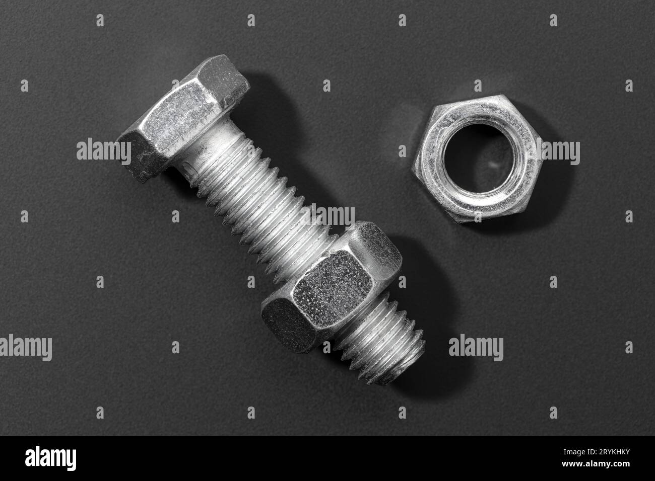 Bolt and nut isolated on black background Stock Photo