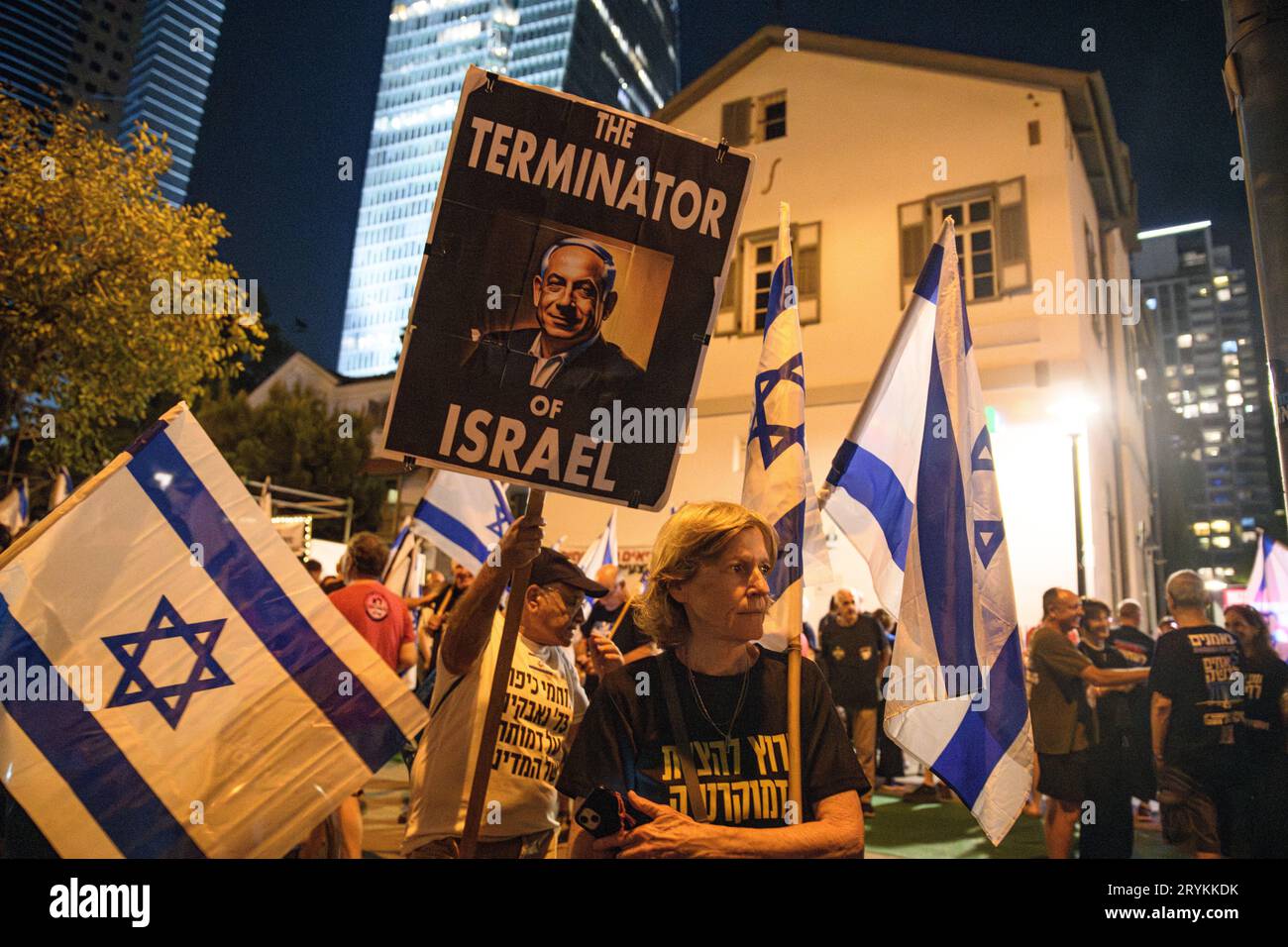 Israeli Terminators Israel. 30th Sep, 2023. A protestor holds a sign with the photo of ...