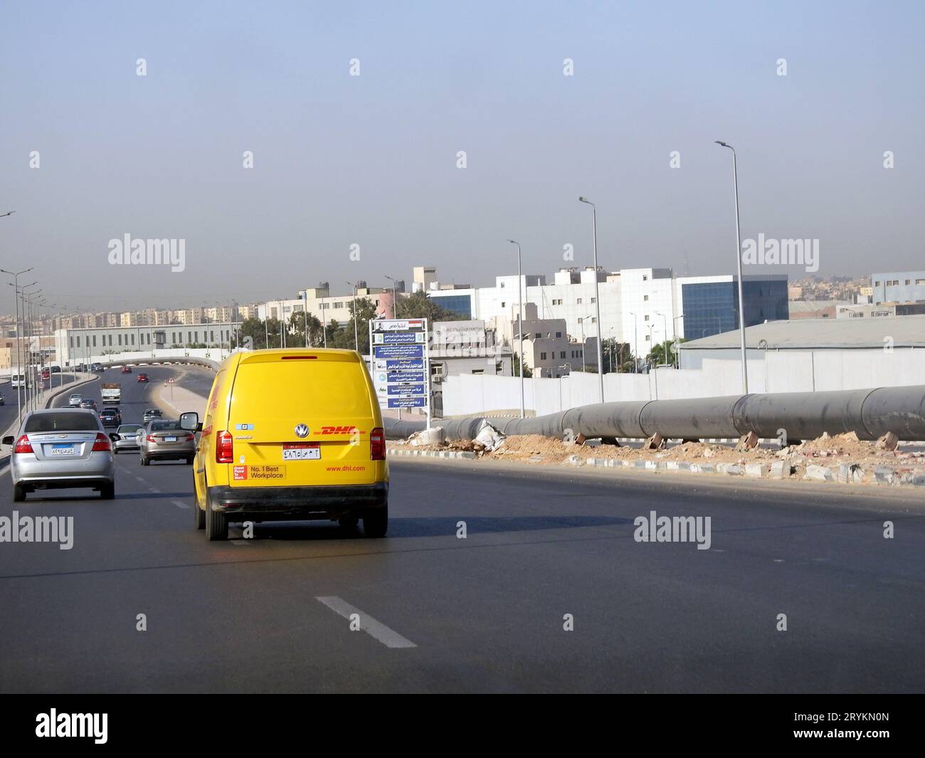 Cairo, Egypt, August 31 2023: DHL truck on its way delivering a package, DHL is the global leader in the logistics industry specializing in internatio Stock Photo