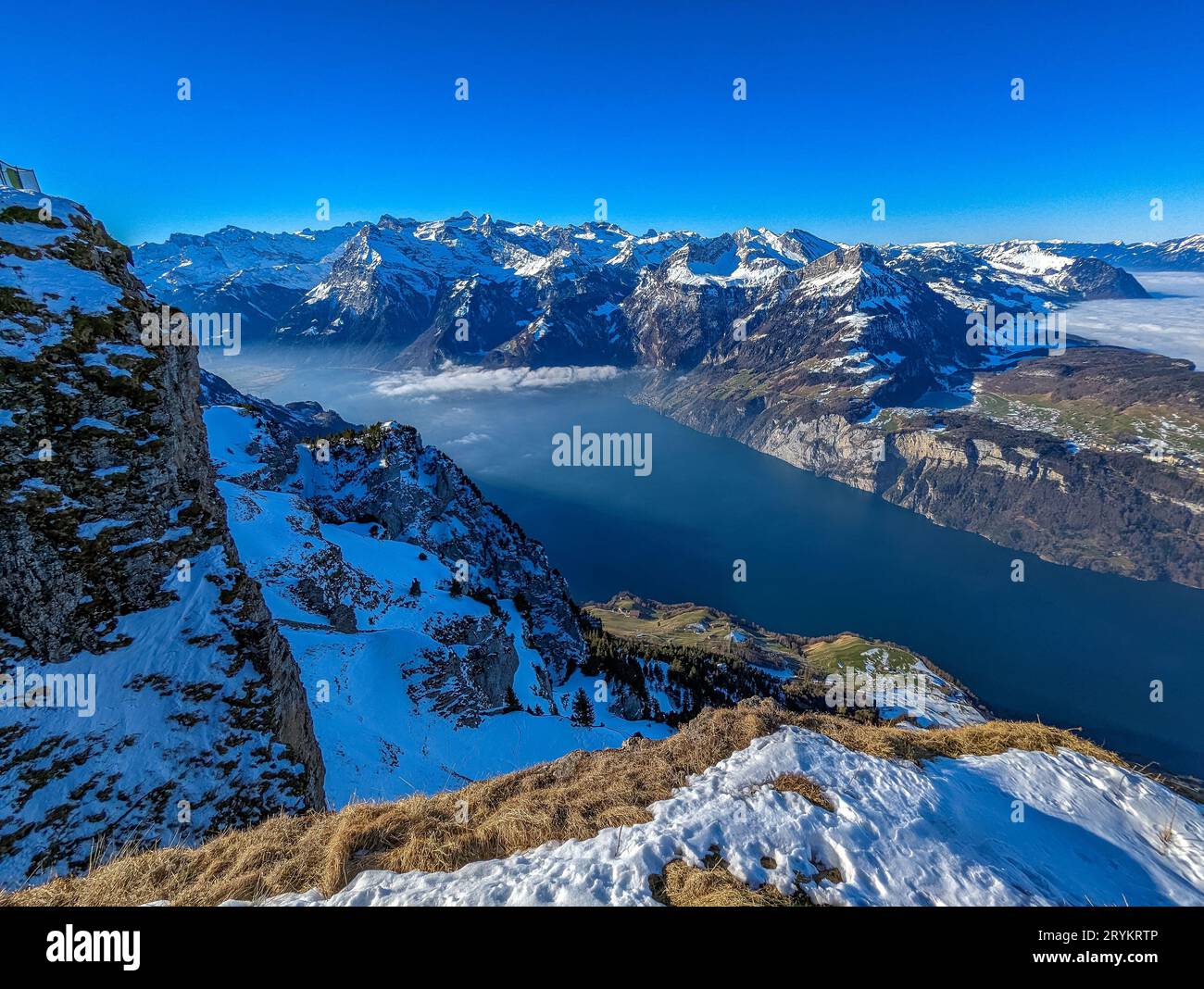 Stoos View Aerial drone view of snow covered mountains and ski slopes, ski area ...
