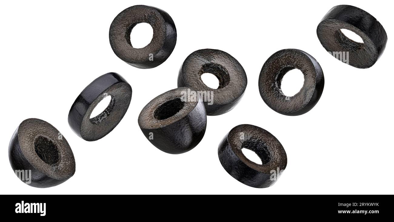 Falling black olive slices isolated on white background Stock Photo
