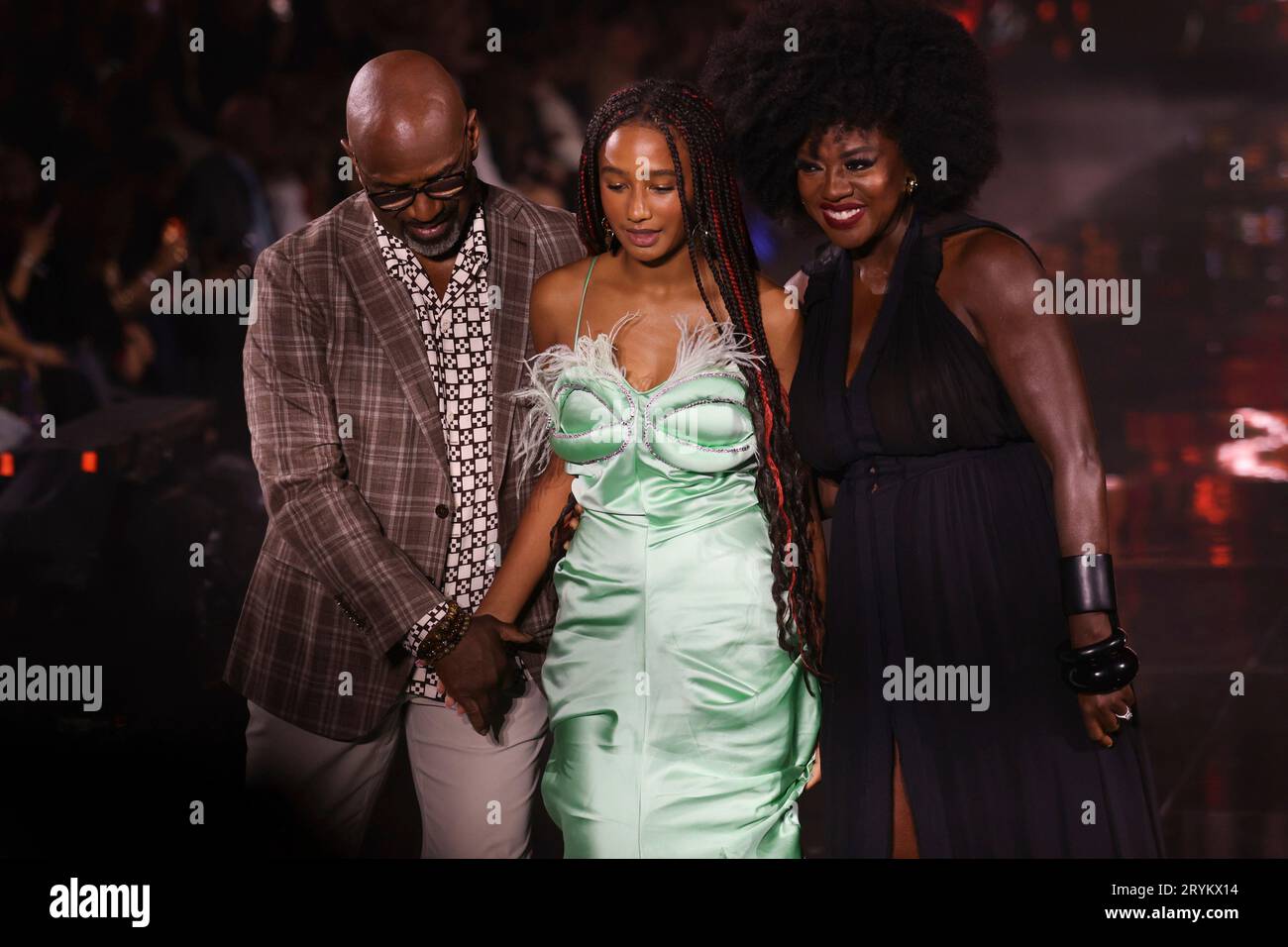 Julius Tennon, from left, Genesis Tennon, and Viola Davis wear