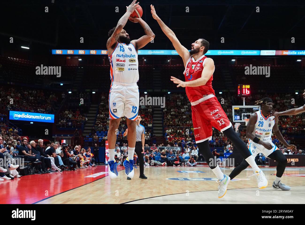 Milan, Italy. 01st Oct, 2023. James Young (Nutribullet Treviso Basket)  thwarted by Nikola Mirotic (EA7 Emporio Armani Olimpia Milano) during EA7  Emporio Armani Milano vs Nutribullet Treviso Basket, Italian Basketball  Serie A