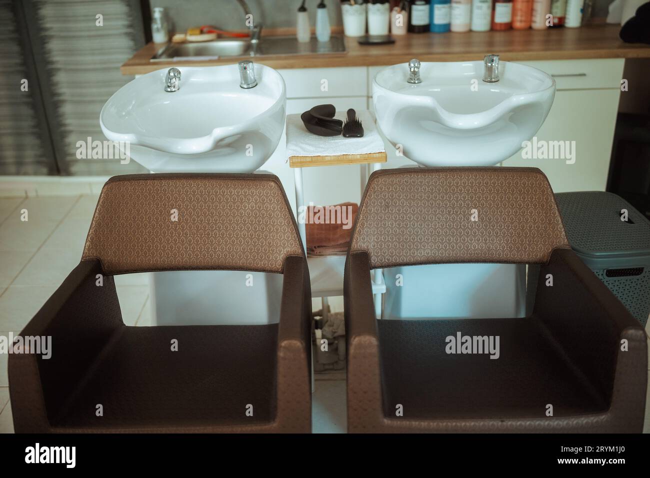 modern hair studio with chairs and salon backwash unit Stock Photo Alamy