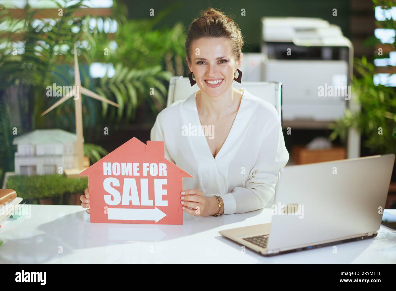 Sustainable real estate business. happy 40 years old business woman in