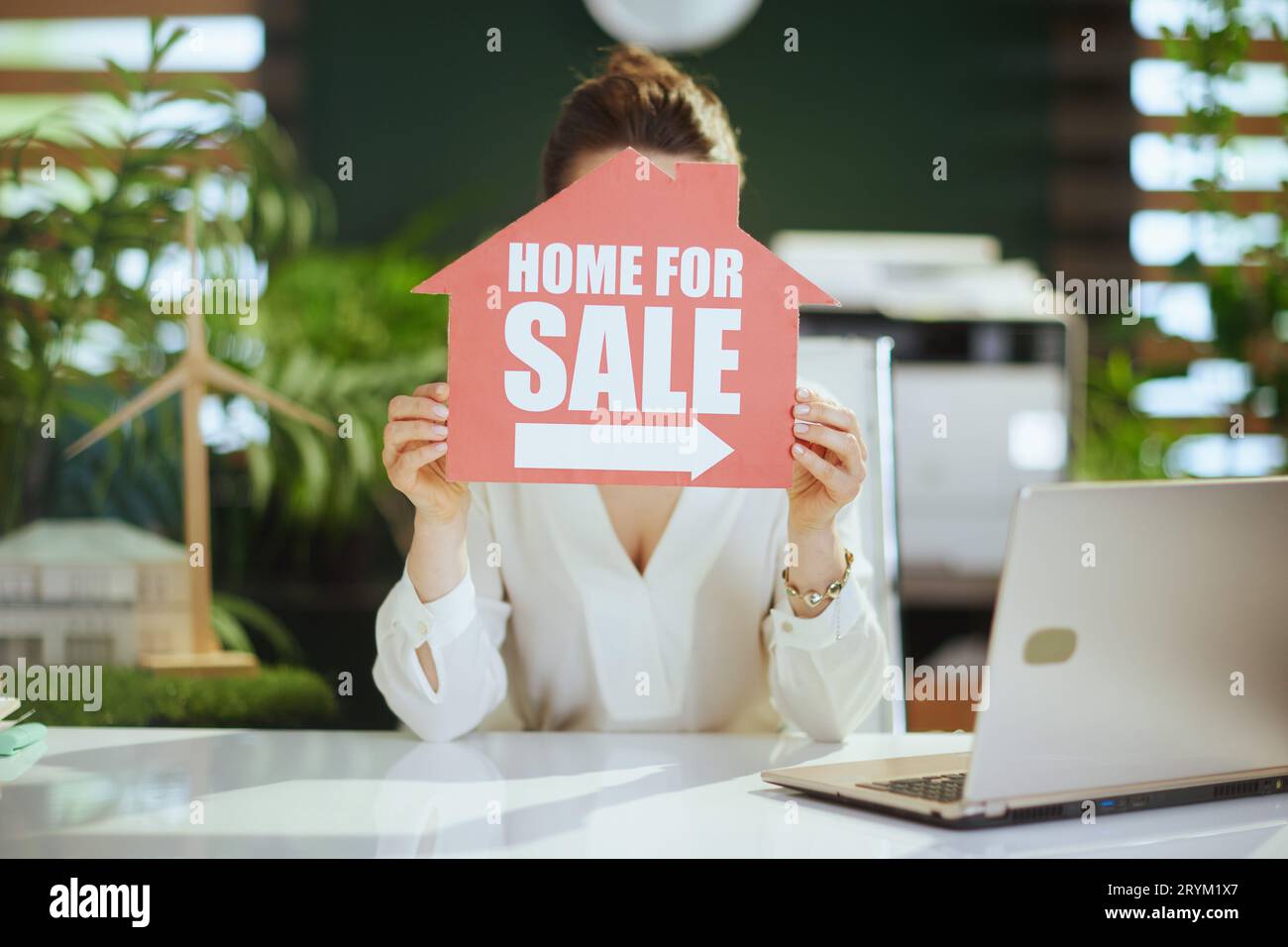 Sustainable real estate business. stylish 40 years old woman real