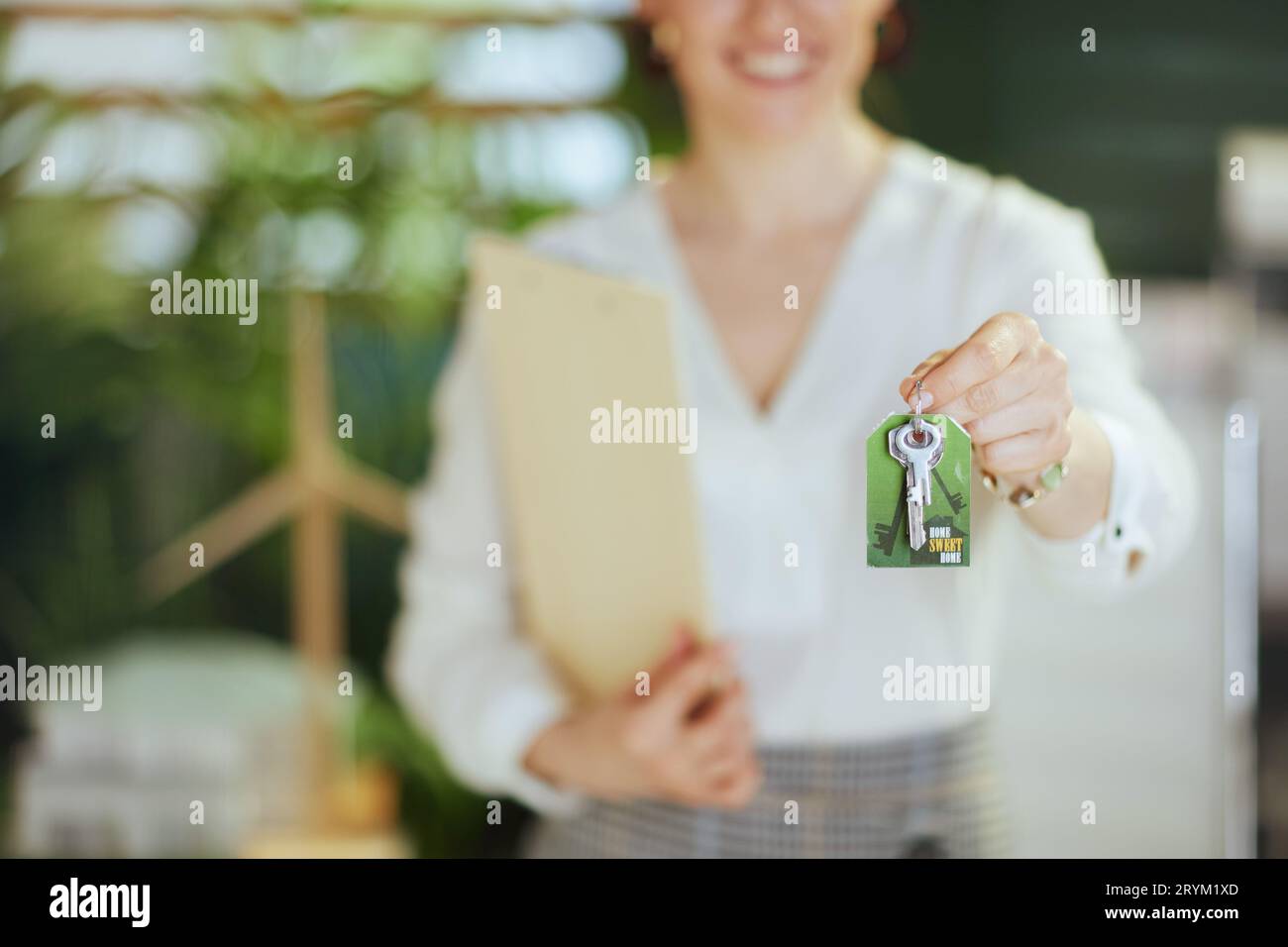 Sustainable real estate business. Closeup on modern female realtor in