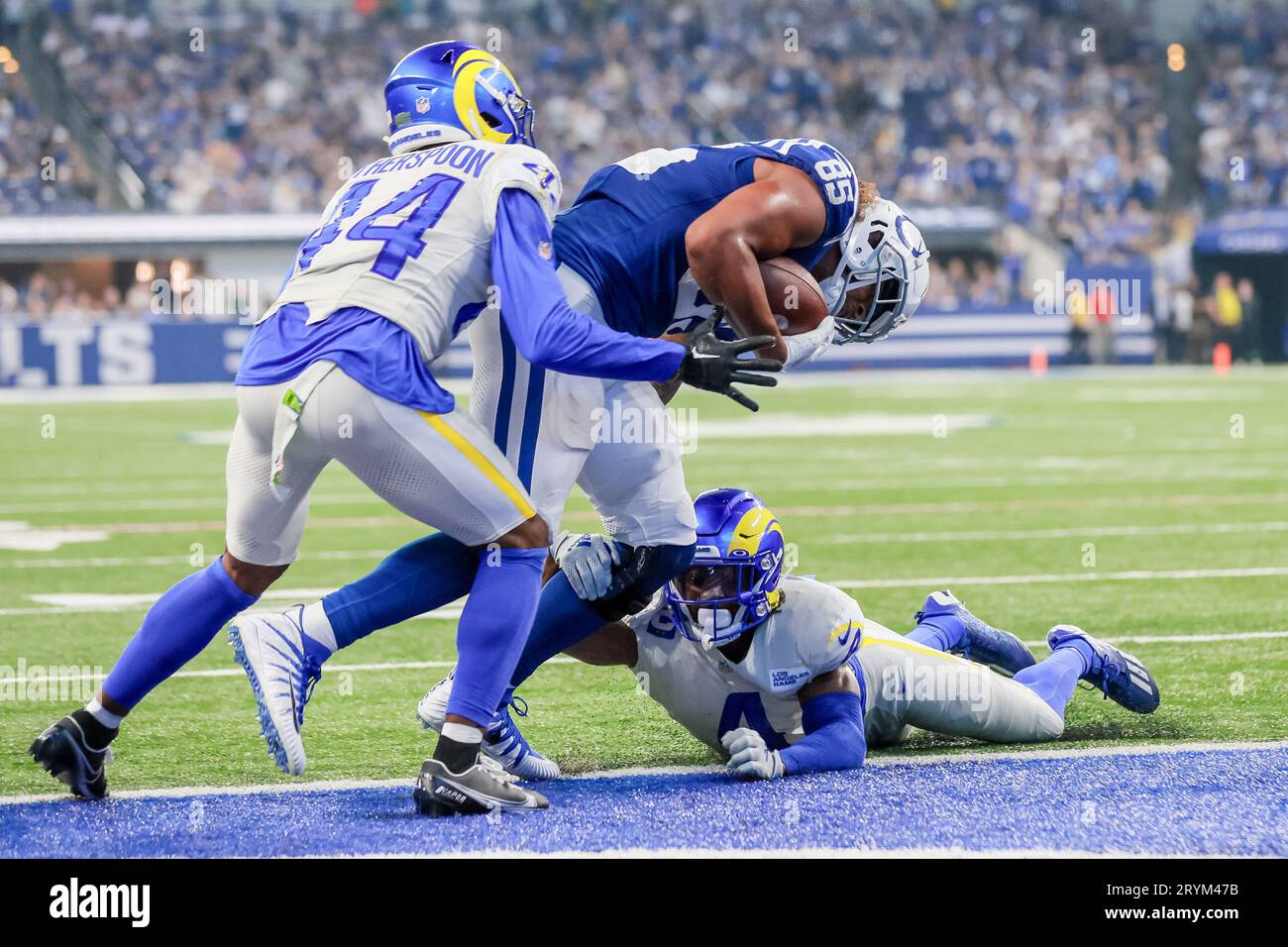 Indianapolis, Indiana, USA. 1st Oct, 2023. Indianapolis Colts tight end Drew Ogletree (85) catches a pass and is hit by Los Angeles Rams safety Jordan Fuller (4) as he scores late in the game between the Los Angeles Rams and the Indianapolis Colts at Lucas Oil Stadium, Indianapolis, Indiana. (Credit Image: © Scott Stuart/ZUMA Press Wire) EDITORIAL USAGE ONLY! Not for Commercial USAGE! Credit: ZUMA Press, Inc./Alamy Live News Stock Photo
