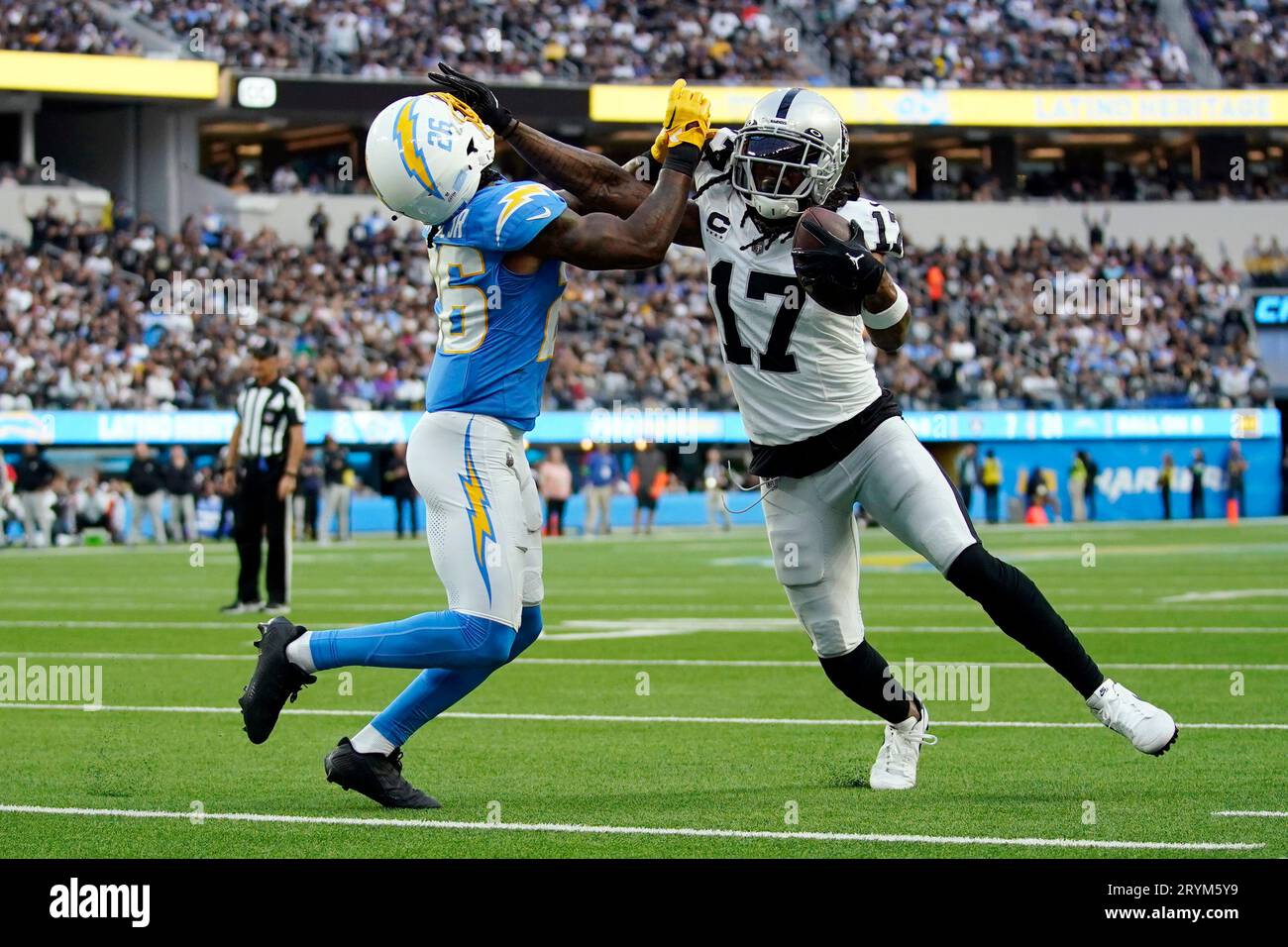 Devante Adams Rams Las Vegas Raiders wide receiver Davante Adams (17) stiff-arms Los ...