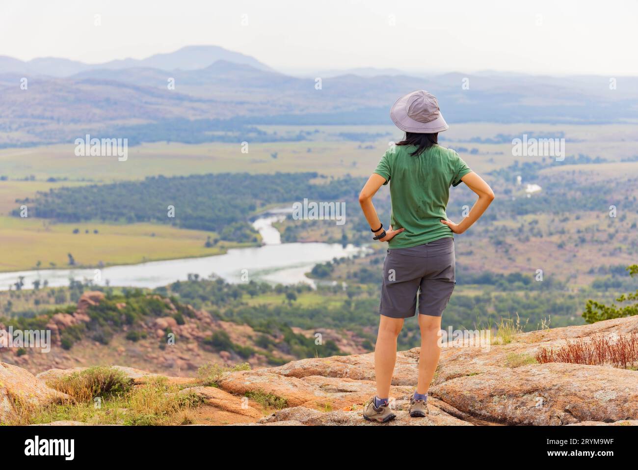 Woman hiking in the Elk Mountain Trail of the Wichita Mountains National Wildlife Refuge at Oklahoma Stock Photo