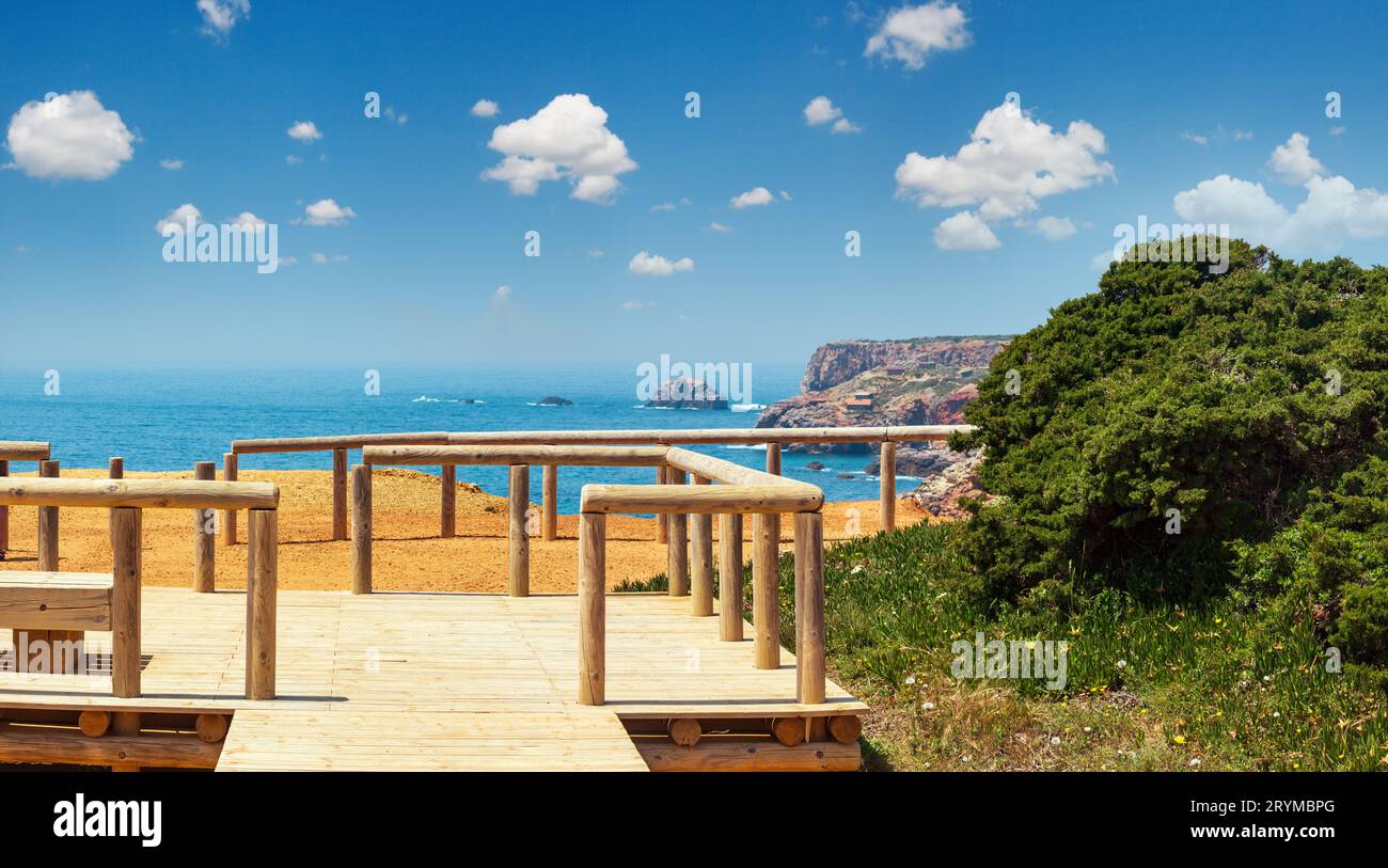 Wooden paths and observation decks on summer Atlantic rocky coast Stock Photo
