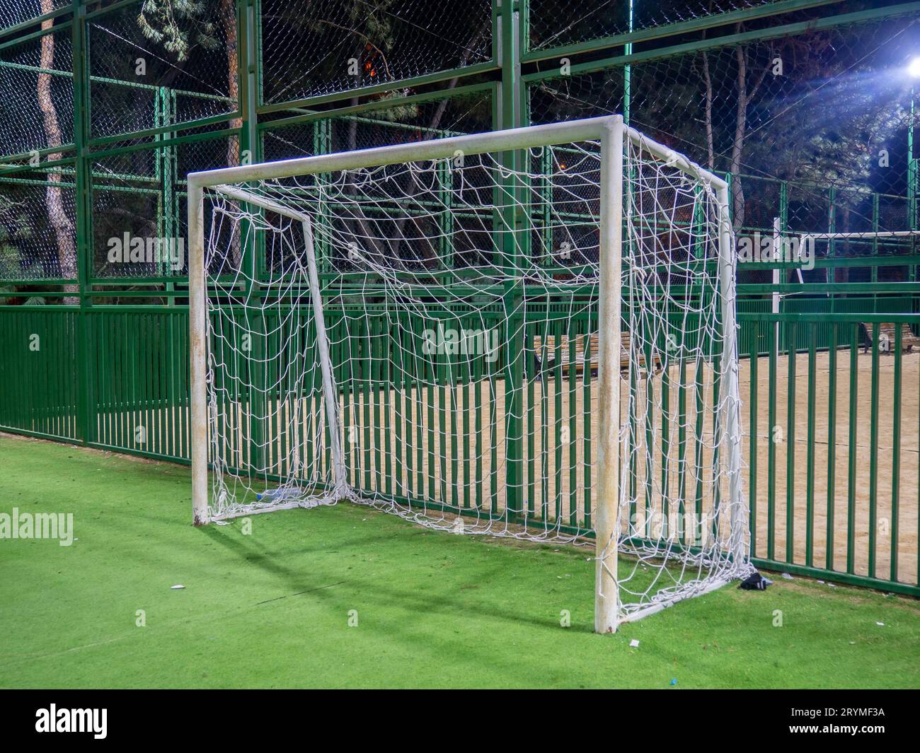 football field in the evening. Artificial lawn. Available infrastructure. Empty sports ground. Football game concept. Sports mesh. Entertainment in th Stock Photo