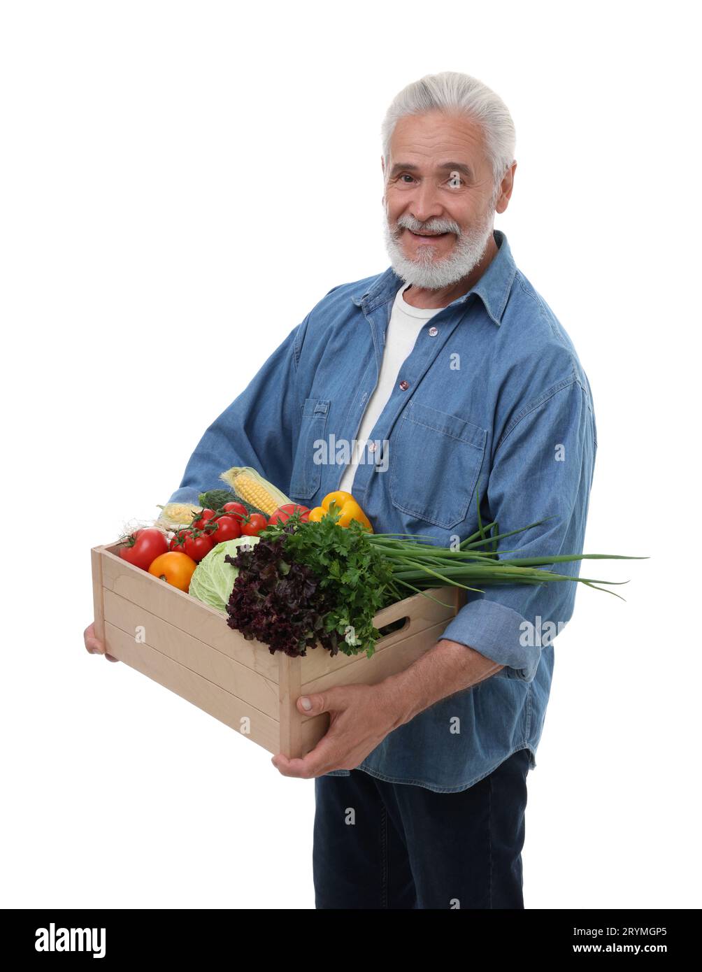 Harvesting season. Happy farmer holding wooden crate with vegetables on ...