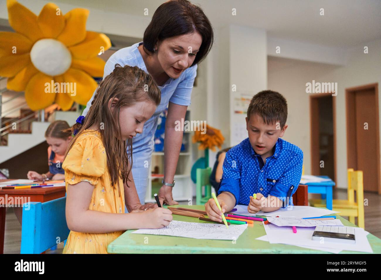 Creative kids during an art class in a daycare center or elementary ...