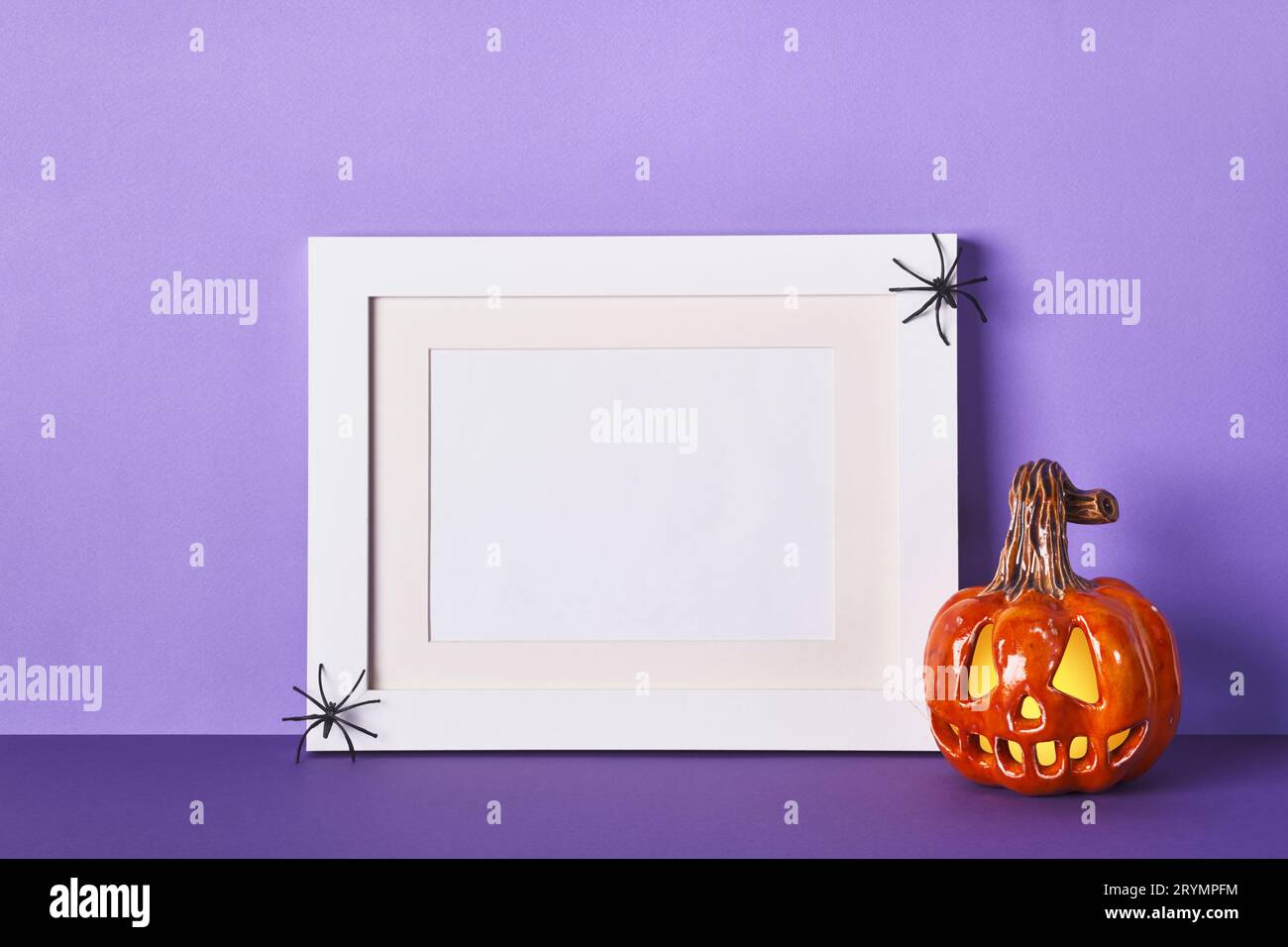 Halloween composition with ceramic pumpkins jack lantern and frame on ...