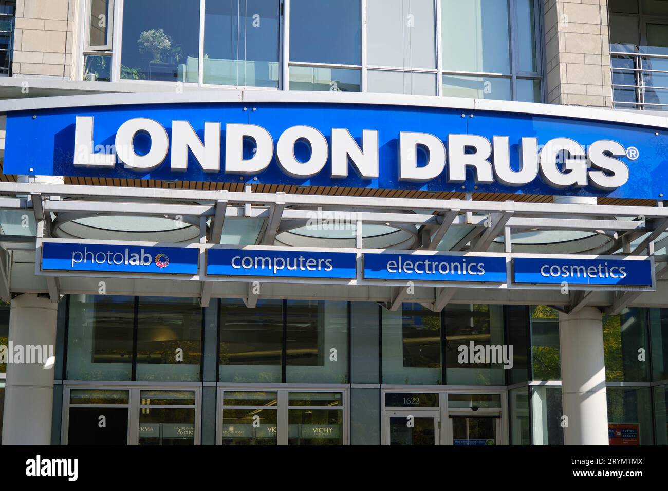 outdoors business sign of London Drugs pharmacy above entrance door Stock Photo