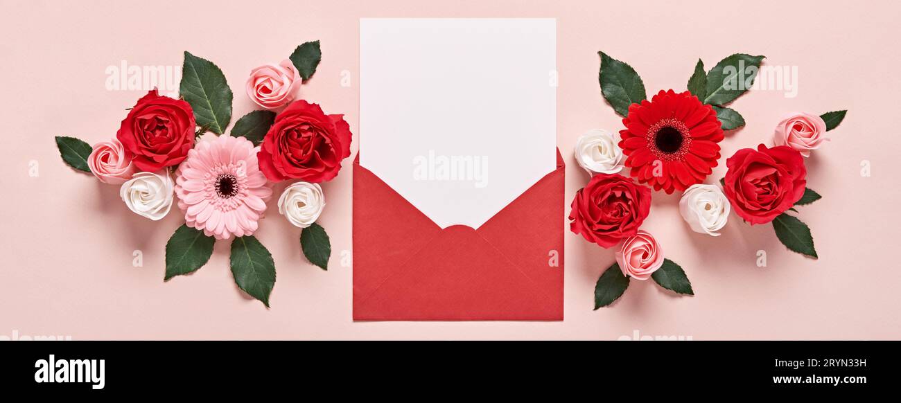 Red envelope with Romantic love letter mockup and flowers on pink Banner Stock Photo