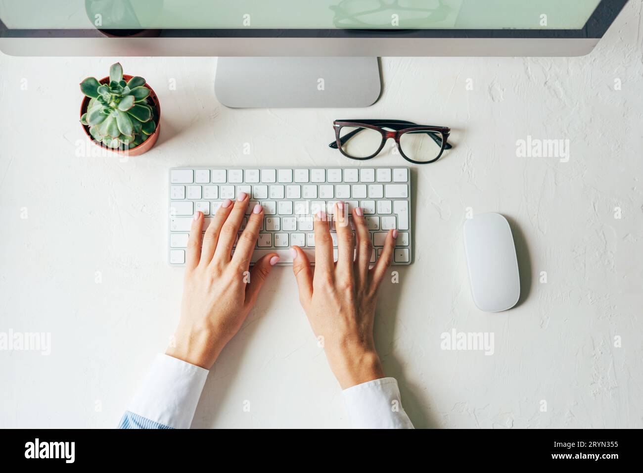 Hands keyboard office white background Stock Photo