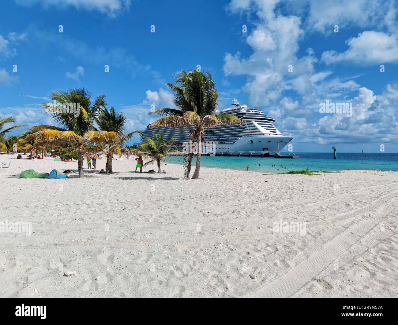 Lighthouse Bay and cruise ship MSC Seashore on the private island of