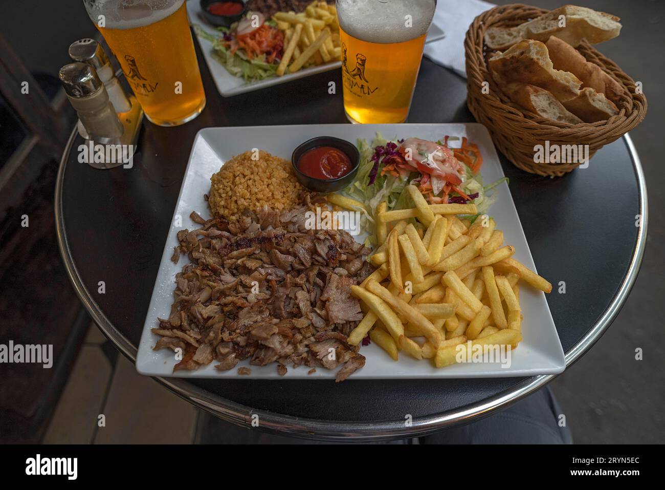 Giros served with fries and rice in a bistro, Paris, France Stock Photo