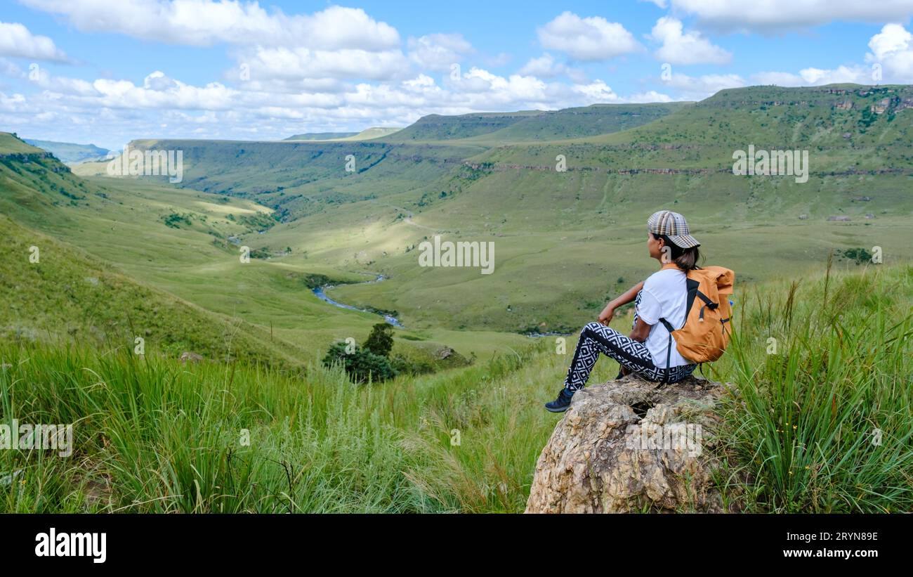 Asian women on a hiking trip in the mountains, Drakensberg Mountain South Africa Stock Photo