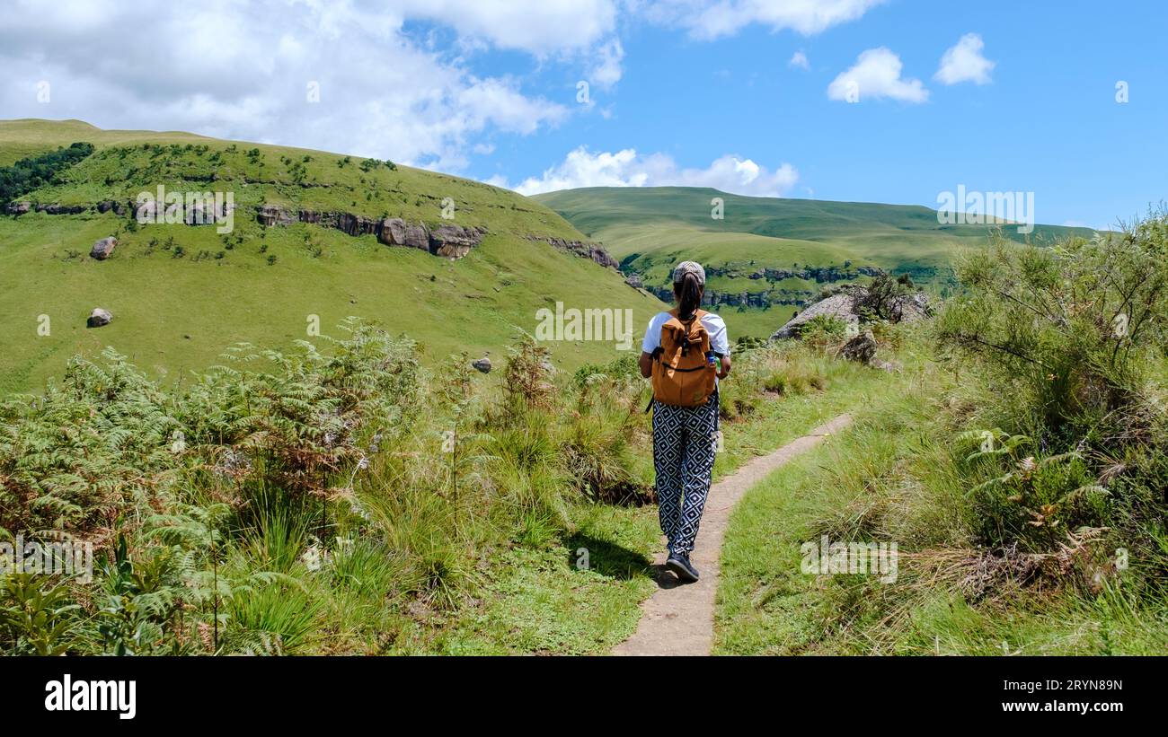 Asian women on a hiking trip in the mountains, Drakensberg Mountain South Africa Stock Photo