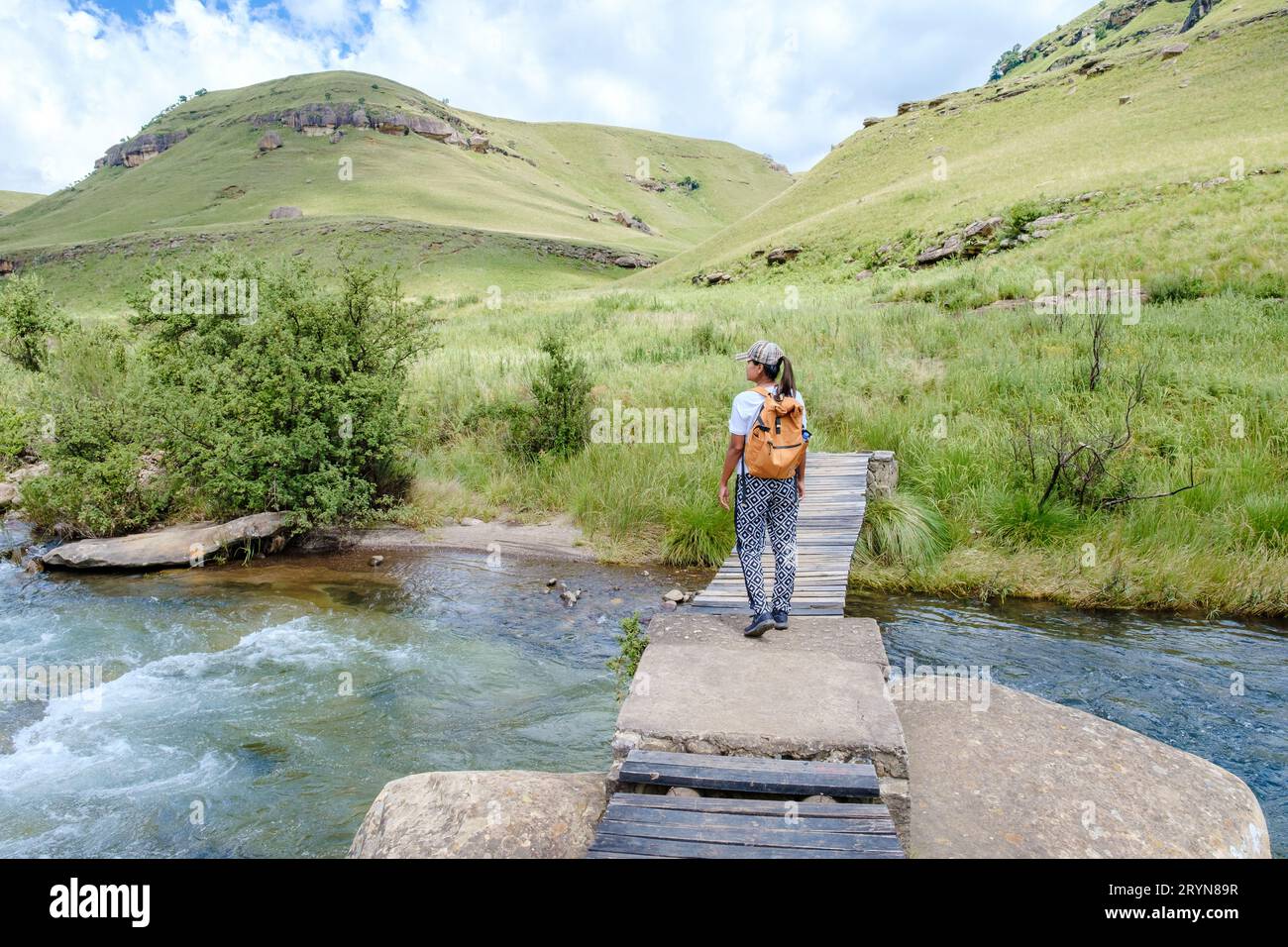 Asian women on a hiking trip in the mountains, Drakensberg Mountain South Africa Stock Photo