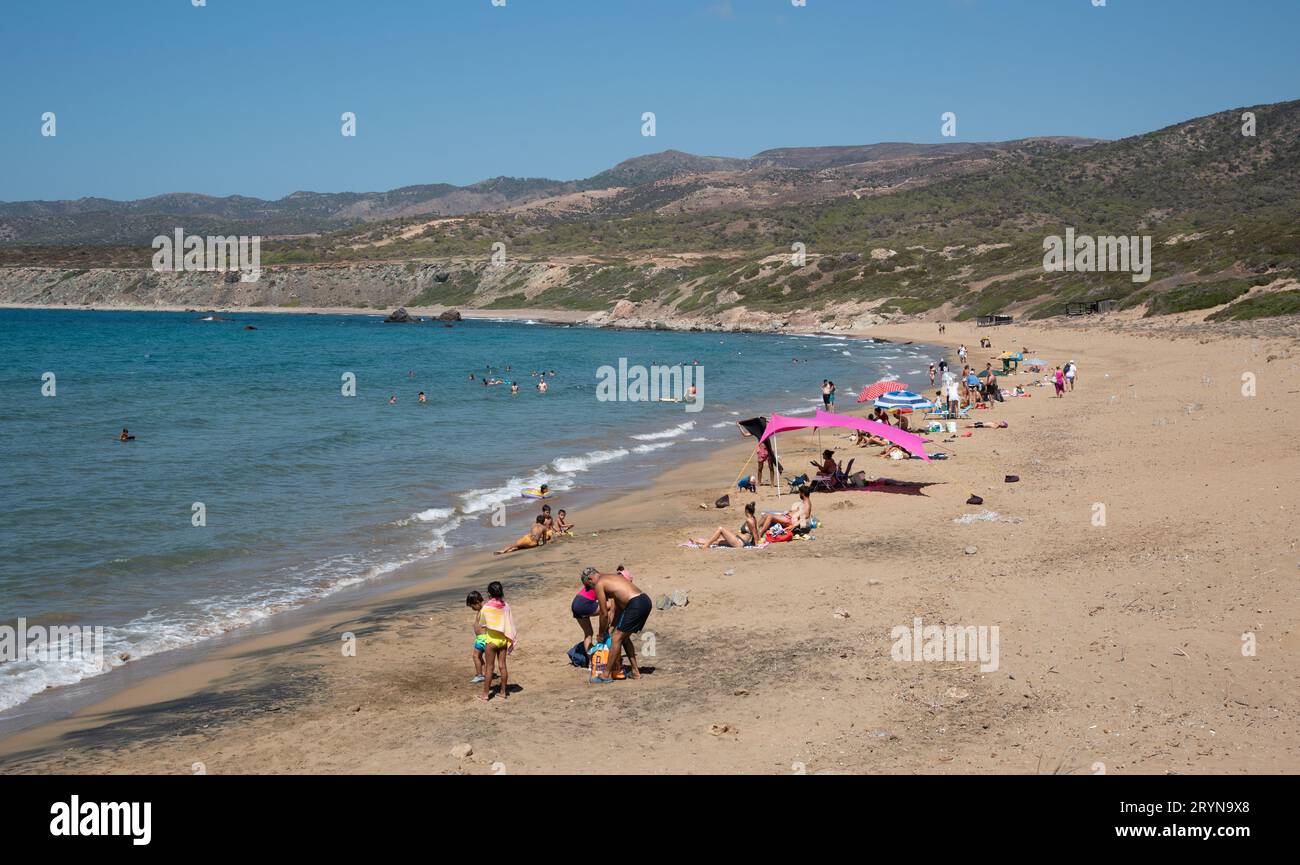 Summer vacations on tropical beach. People in the sea. Lara beach, Akamas peninsula Cyprus Stock Photo