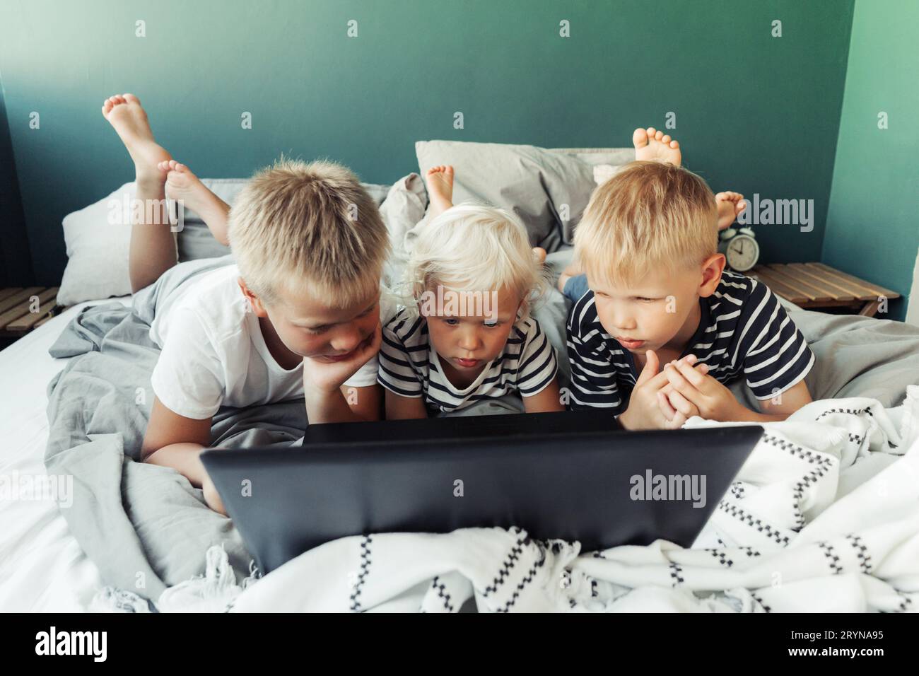 School kids is studying online. Home schooling. Distance education. Stock Photo