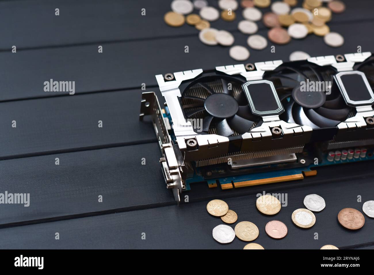 Cryptocurrency mining concept with bitcoins on a computer videocard Stock Photo