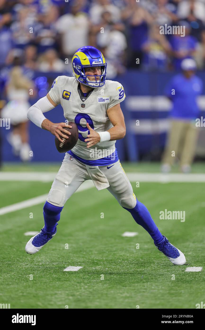 Indianapolis, IN USA;  Los Angeles Rams quarterback Matthew Stafford (9) scrambles out of the pocket and runs with the football during an NFL game aga Stock Photo