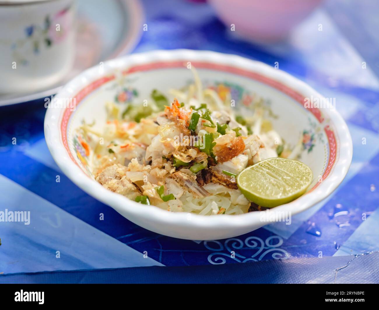 Thai street food . Noodle Tom Yum, noodles with pork and hot spicy