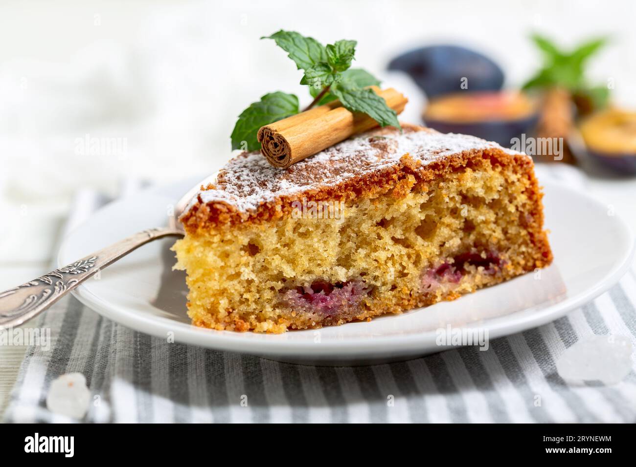 Piece of pie with blue plums. Stock Photo
