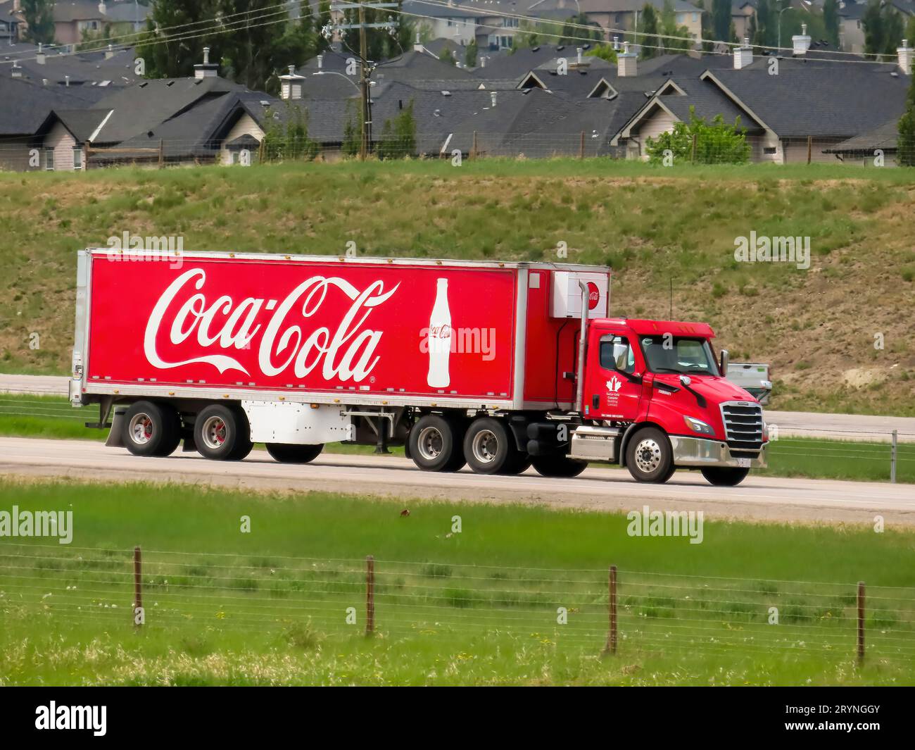 Calgary, Alberta, Canada. May 30. 2023. A Coca Cola trailer Semi Cargo truck on the route in springtime. Stock Photo