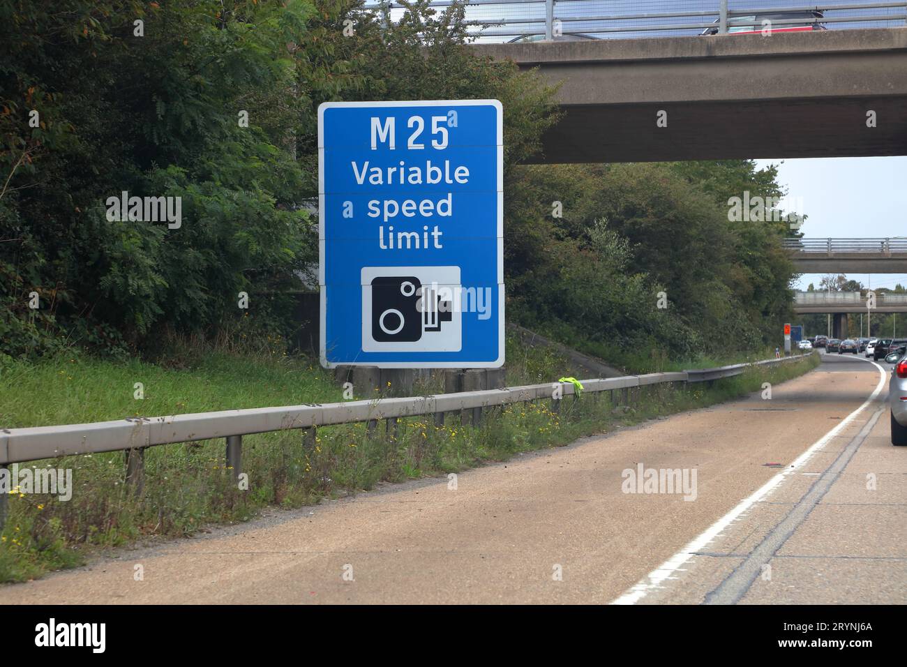 Travelling along the M25 Motorway with roadside signage indicating speed enforcement on the imposed variable speed. Stock Photo