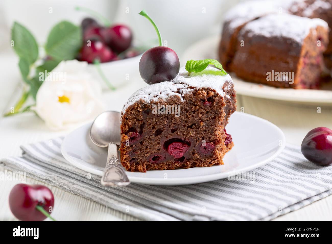 Piece of chocolate pie with cherries. Stock Photo