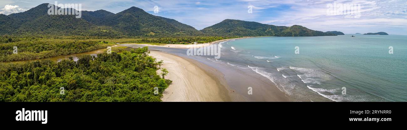 Aerial view panorama of Green Coast shoreline with turquoise water, beach, river and green mountains Stock Photo