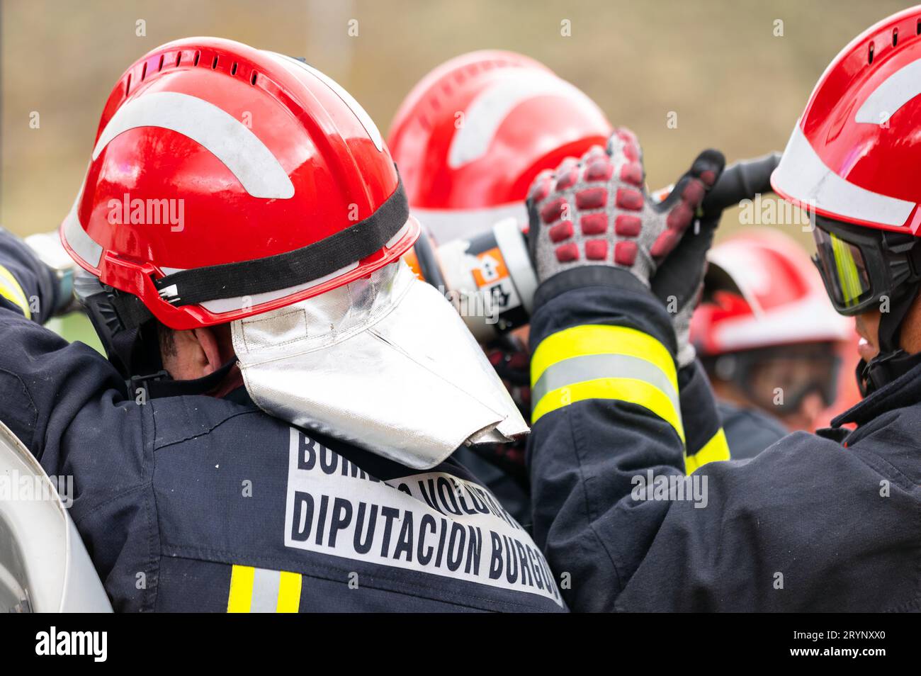 Firefighters using hydraulic tools during a rescue operation training