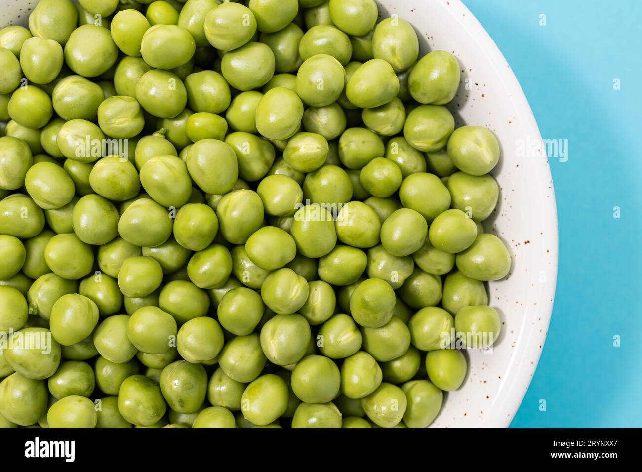 Close up of Fresh green peas in bowl Stock Photo