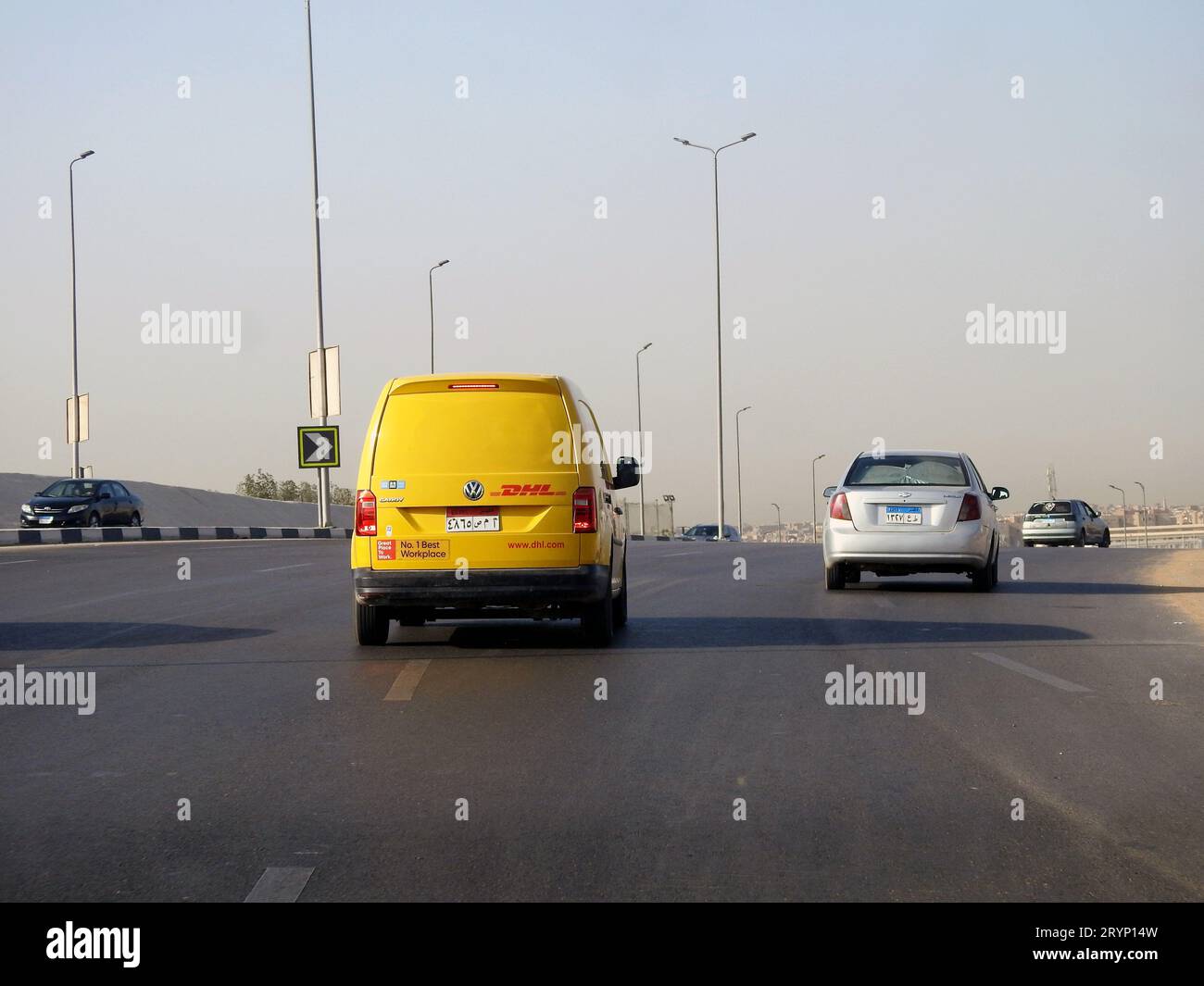 Cairo, Egypt, August 31 2023: DHL truck on its way delivering a package, DHL is the global leader in the logistics industry specializing in internatio Stock Photo