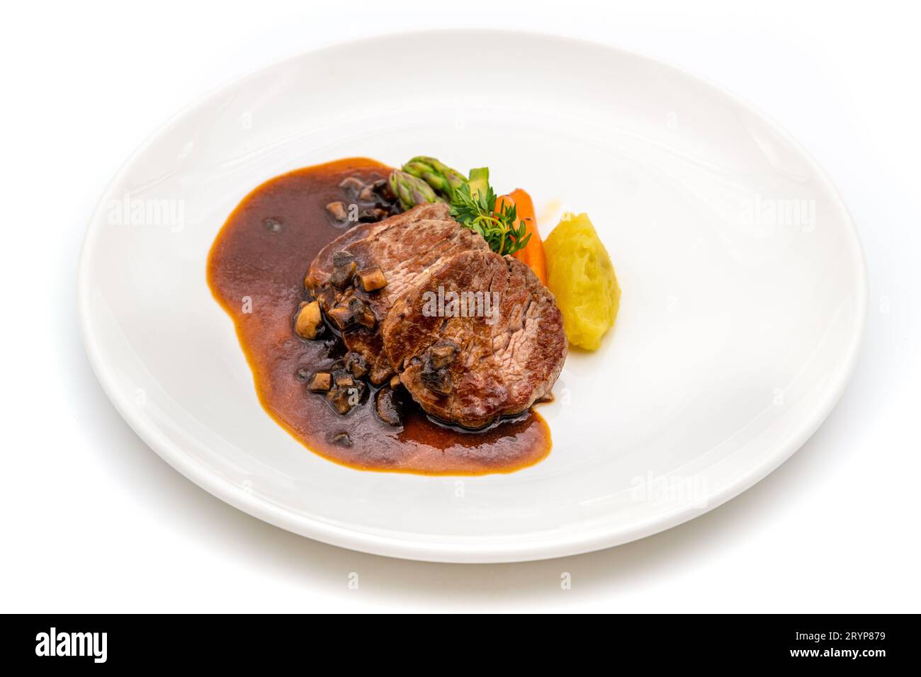 Grilled beef tenderloin with grilled vegetables and Demiglace sauce on