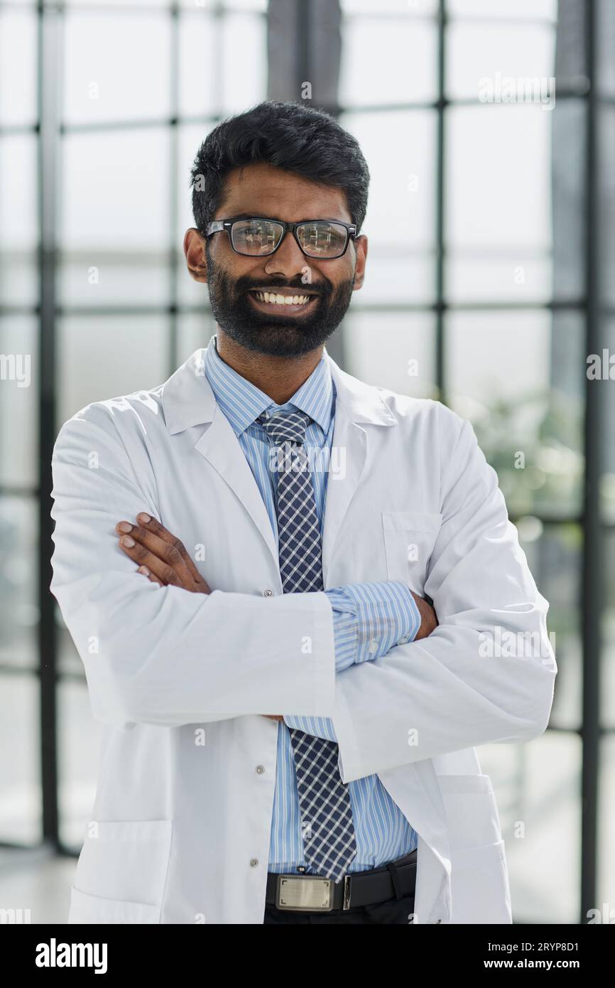 Portrait of a smiling male doctor standing in a hospital corridor Stock ...