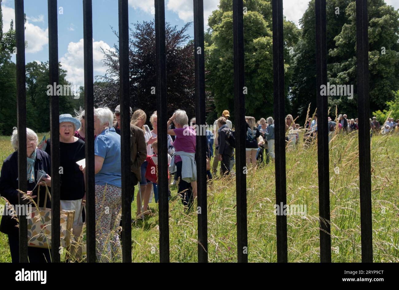 The Hospital of St Cross and Almshouse of Noble Poverty annual summer fete thats has taken place for over 150 years. About 2,000 people attended in 2022. Local visitors queuing up waiting to be allowed in. Winchester, Hampshire, England 25th June 2022.  2020s UK HOMER SYKES Stock Photo