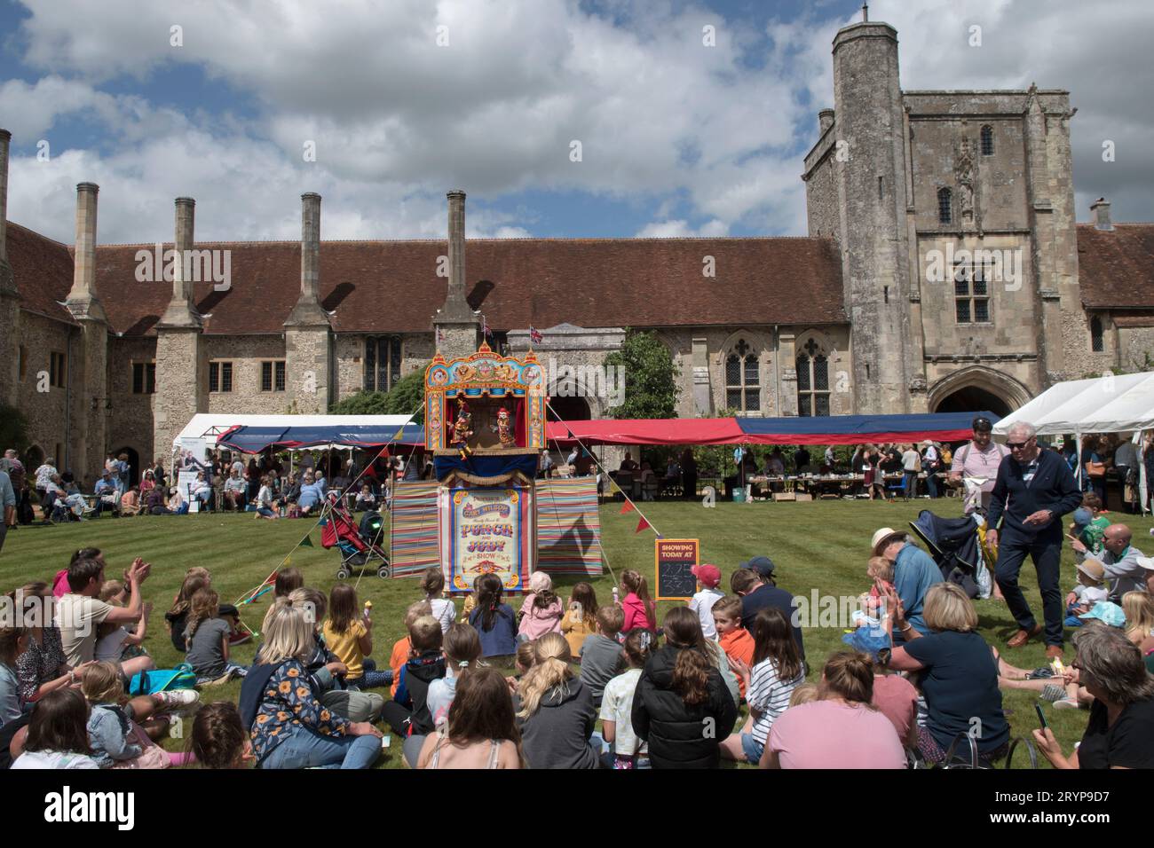 The Hospital of St Cross and Almshouse of Noble Poverty annual summer fete thats has taken place for over 150 years. About 2,000 people attended in 2022. Winchester, Hampshire, England 25th June 2022.  2020s UK HOMER SYKES Stock Photo