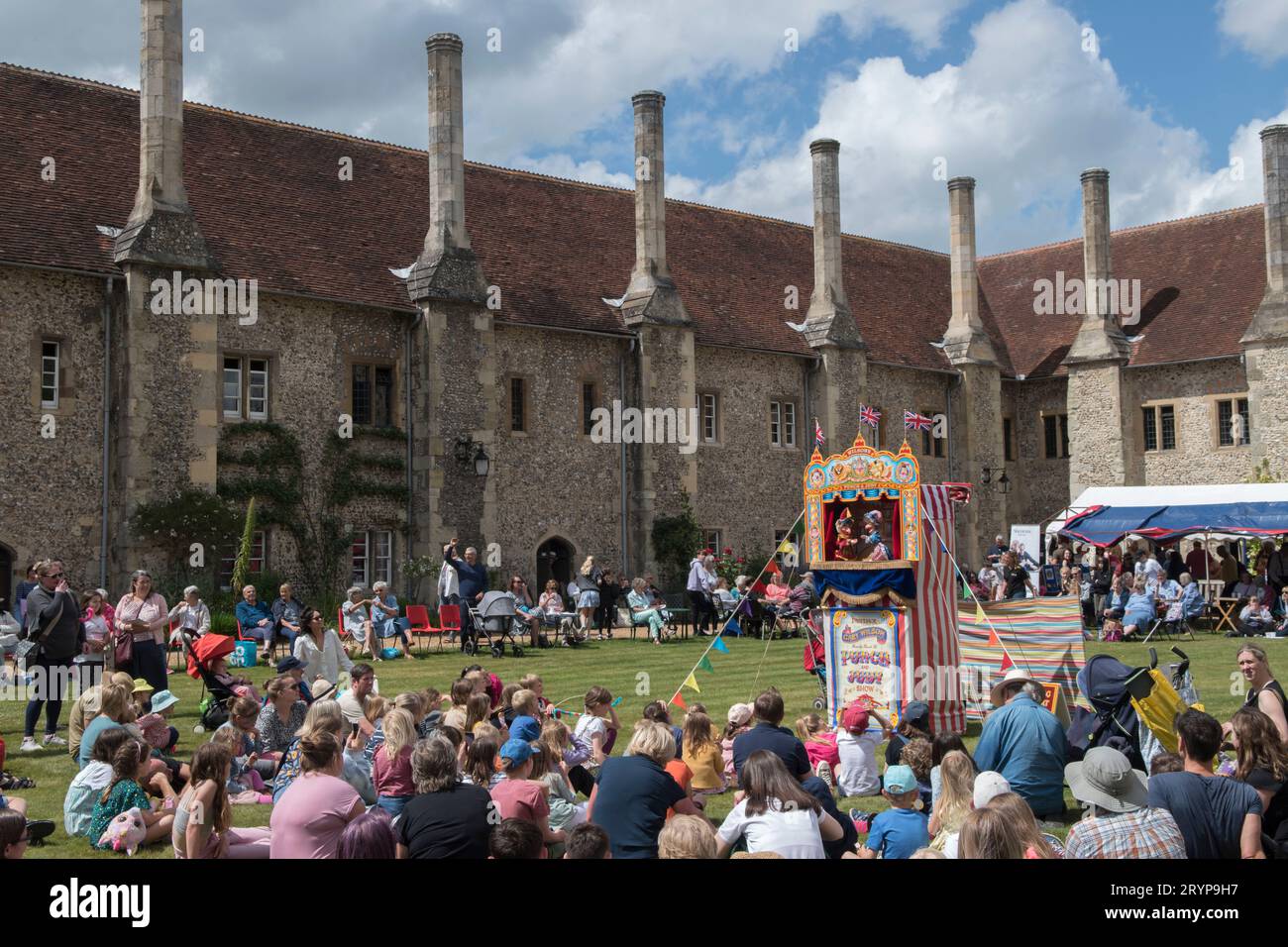 The Hospital of St Cross and Almshouse of Noble Poverty annual summer fete thats has taken place for over 150 years. About 2,000 people attended in 2022. Winchester, Hampshire, England 25th June 2022.  2020s UK HOMER SYKES Stock Photo