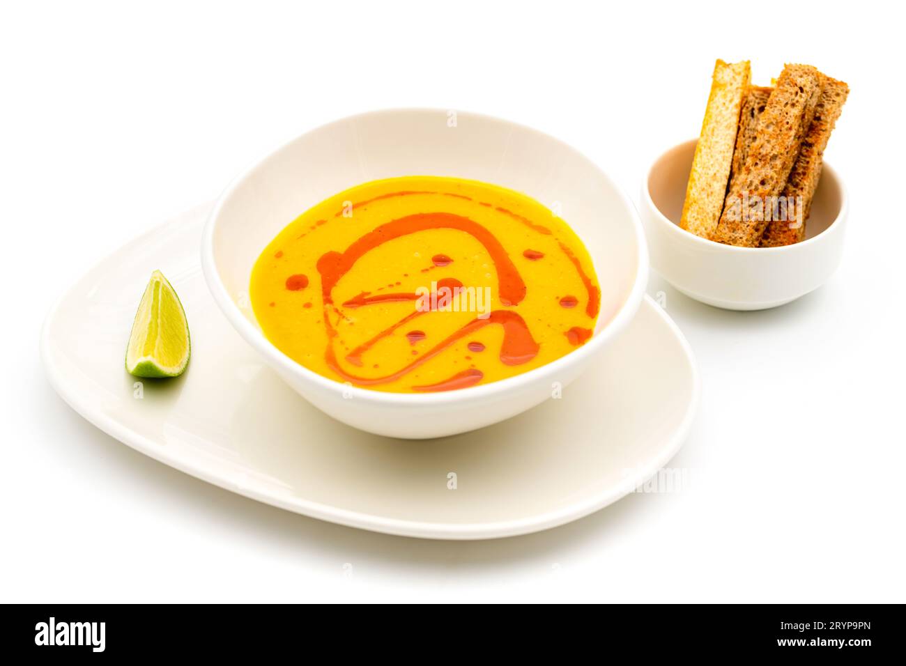 Strained lentil soup on a white porcelain plate Stock Photo
