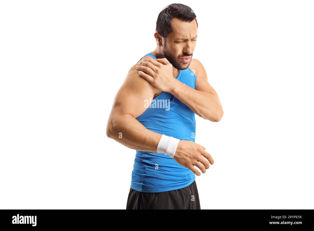 Male athlete holding his shoulder in pain isolated on white background Stock Photo