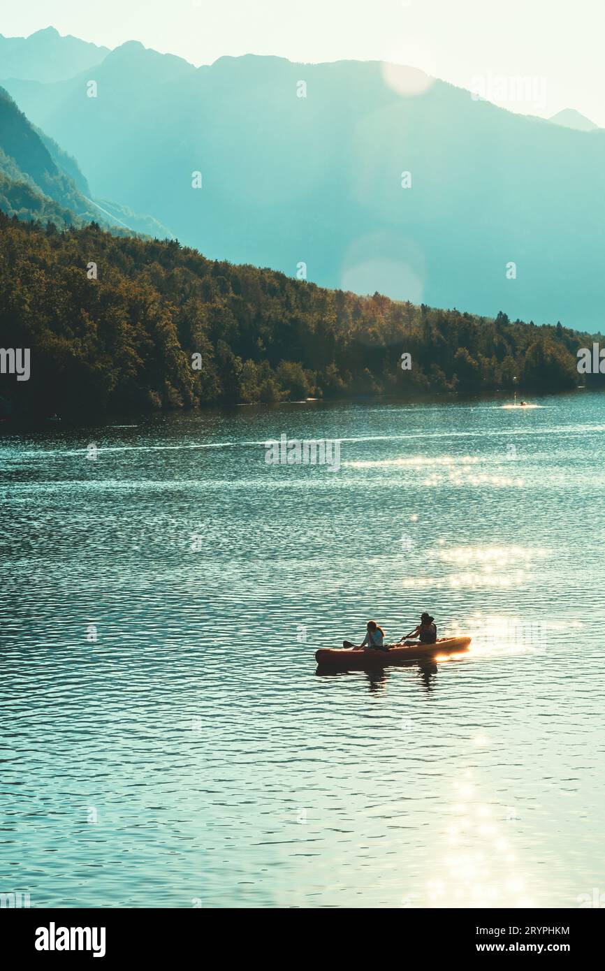 Lake Bohinj water sport and recreational outdoor activity in summer afternoon Stock Photo